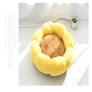 Close-up detail of a sunflower-shaped yellow plush cat bed with soft fleece texture.