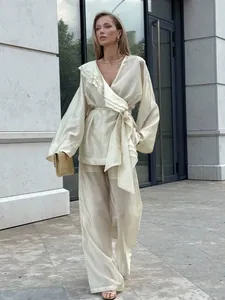 Elegant beige tencel ruffle set with wrap top and wide-leg pants for women