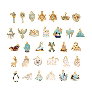 Diverse collection of winter-themed enamel charms including snowflakes and polar bears