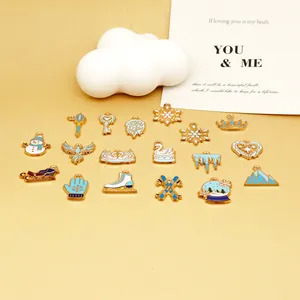 Detailed view of various light blue and white winter-themed enamel alloy charms