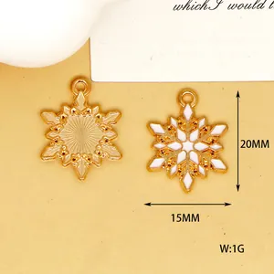 Detailed macro view of 20mm gold and white enamel snowflake shaped alloy pendants
