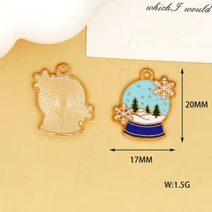Detailed view of winter snow globe enamel charm showing front and back with 20mm height
