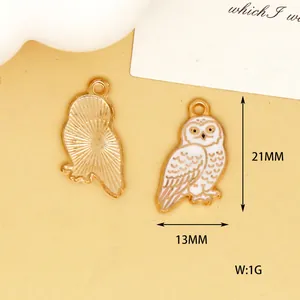 Detailed view of snowy owl charms showing dimensions of 21mm by 13mm and back texture