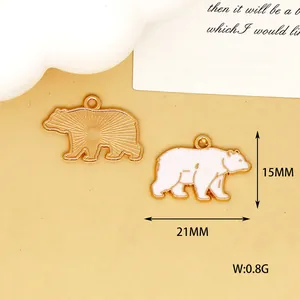 Detailed view of a polar bear enamel charm with 21mm and 15mm size measurements