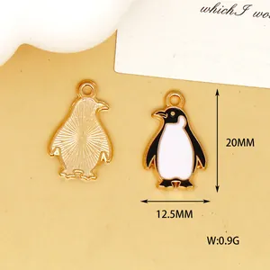 Close-up detail of small penguin enamel charm for DIY jewelry shown with dimensions