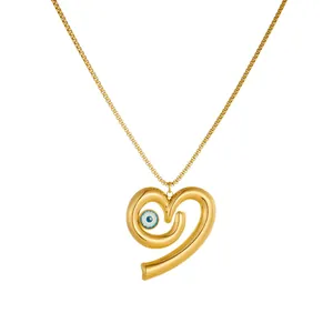 Detailed view of the gold heart pendant featuring a blue evil eye on a box chain