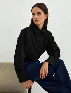 Elegant black long-sleeved cotton shirt featuring unique structured pleated shoulder details