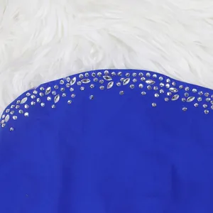 Close-up of sparkling silver rhinestone details on royal blue slip dress fabric