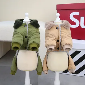 Detail view of thick warm quilted dog winter jackets in olive green and tan colors.