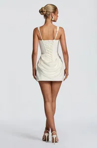 Detailed back view of a white sleeveless mini dress with elegant lace-up corset styling