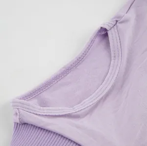 Macro detail view of the breathable purple cotton neckline on this pet recovery suit
