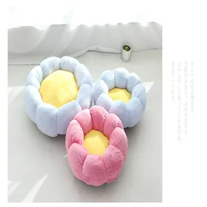Detailed macro view of soft plush flower-shaped pet beds in vibrant pink and blue colors