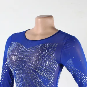 Close-up detail of sexy blue floor-length dress with sparkling rhinestone patterns.