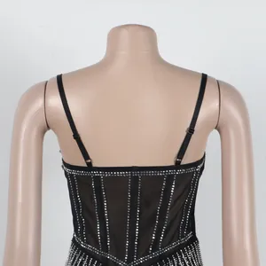 Detailed back view of a black bodycon strap dress decorated with vertical rhinestone patterns