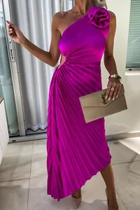 Detail of magenta one-shoulder pleated dress with waist cutout and decorative rose
