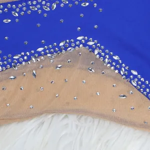 Close-up of sheer mesh evening dress with sparkling rhinestones and royal blue fabric