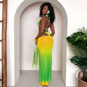 Back view of sexy yellow-green gradient bikini with matching mesh maxi skirt