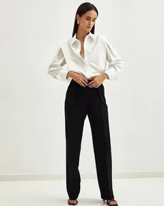 Full view detail of white structured shoulder cotton shirt with black tailored pants