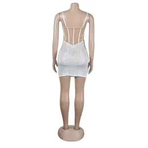 Back view detail of white bodycon mini dress with rhinestone stripes and mesh panels