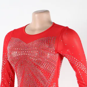 Detail of red evening dress with sparkling silver rhinestones on sheer mesh fabric.