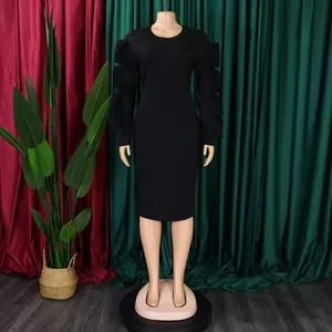 Elegant plus size black long sleeve dress with stylish ruffle sleeve details shown