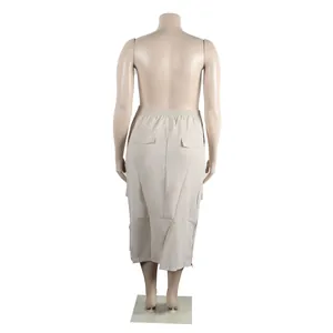 Back view detail of a stylish beige cargo midi skirt with elastic waist and pockets