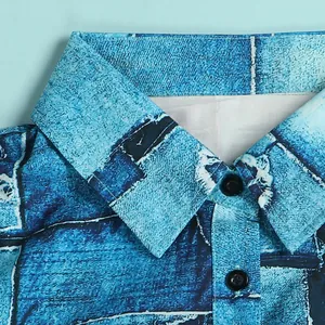Detailed close-up view of a stylish blue abstract print dress collar and buttons