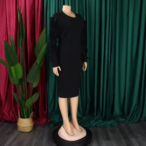 Elegant black plus size long-sleeved midi dress featuring unique ruffled sleeve details
