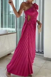 Exquisite detail of a hot pink one-shoulder pleated maxi dress featuring waist cutout