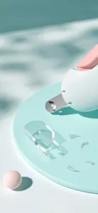 Close-up of a pet nail clipper with a transparent splash-proof shield on a mint base.