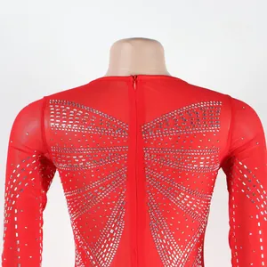Close-up of the back of a red rhinestone gown with a zipper closure.