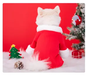 Detailed back view of a dog wearing a red and white plush Christmas Santa outfit on fur