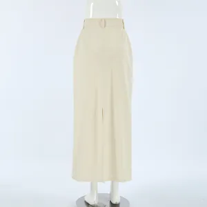 Rear view of a minimalist beige high-waist straight denim skirt with back slit detail