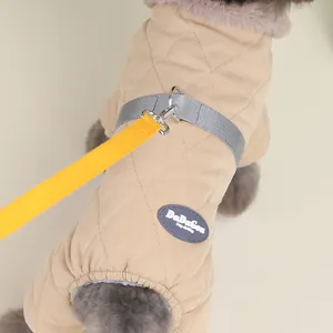 Detailed macro shot of warm quilted winter dog coat with diamond stitching and logo patch