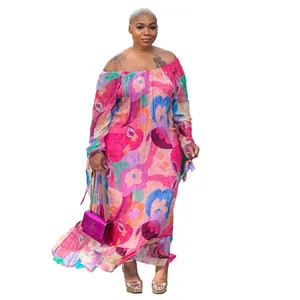 Full-length view of a vibrant pink floral off-the-shoulder maxi dress on a plus size model