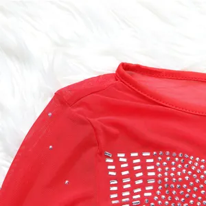 Detail view of a sexy red mesh dress with intricate rhinestone patterns for evening wear.