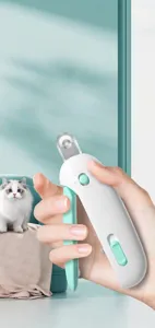 Close-up of pet nail clipper with adjustable circular hole and ergonomic grip for cats