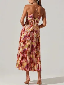Elegant floral print pleated midi dress with cross-back tie and sleeveless design.