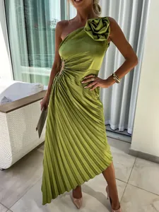 Elegant one-shoulder pleated green dress with floral detail and waist cutout