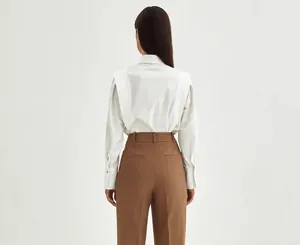 Back view of an elegant white cotton shirt featuring unique shoulder pleat detail