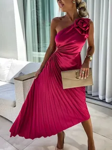 Elegant fuchsia one-shoulder pleated maxi dress with 3D floral accent and side cutout.