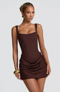 Detail of brown sleeveless bodycon dress featuring corset bodice and draped skirt