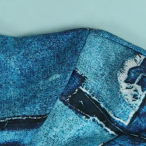 Macro detail shot showing the precise stitching and blue print texture of a slim fit dress