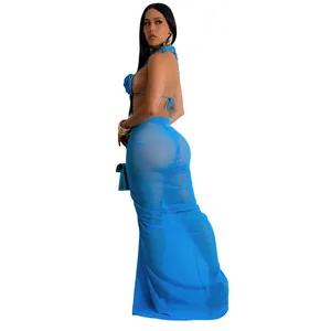 Back view of professional model wearing blue sheer mesh maxi skirt and halter bikini set