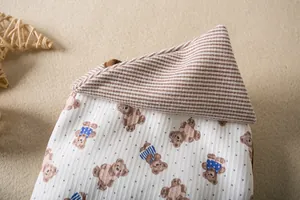 Detail view of the soft ribbed fabric with cute bear prints on this pet base vest
