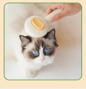 Spazzola autopulente per animali domestici rimuove il sottopelo da un gatto soffice