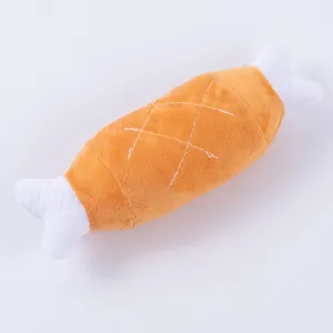 Detailed view of soft plush fabric on a squeaky chicken leg bone shaped dog toy.