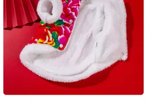 Detailed view of the thick white fleece lining of a pet jacket with floral pattern.