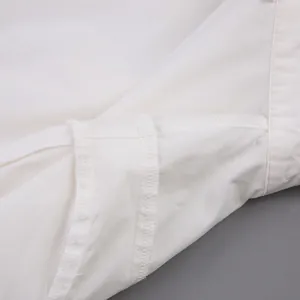 Detailed close-up showing the high-quality internal stitching of white cotton blouse