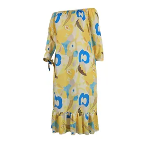 Detailed view of yellow and blue floral print one-shoulder dress with ruffled hem